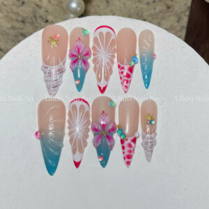 3D fruit and flower press on nails featuring embossed lemon slices, pink hibiscus, and textured wave design