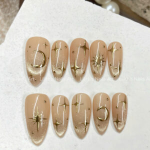 Celestial press on nails with gold 3D stars and moon chrome art on nude cat eye magnetic base, almond shape