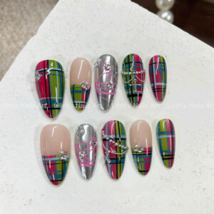 Handmade metallic silver nails featuring a pink Vivienne-inspired orb and sparkling rhinestones on almond shape